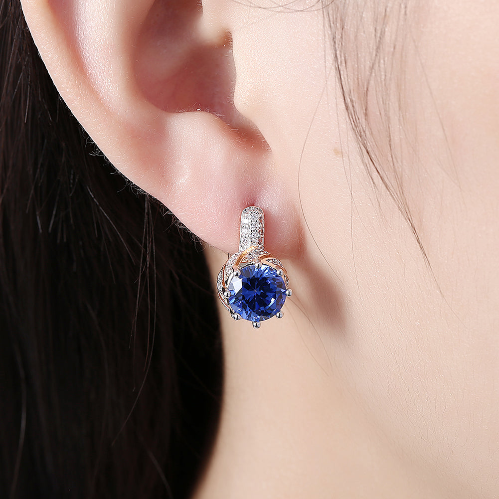 Elegant Vienna 1.00 Ct Sapphire Round Cut Huggie Earring in 18K Gold Plated, showcasing a brilliant sapphire set in a gold-plated huggie design.